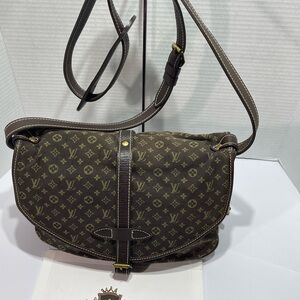 Louis Vuitton Saumur Mini Lin Canvas, with brown leather handle with dust bag.